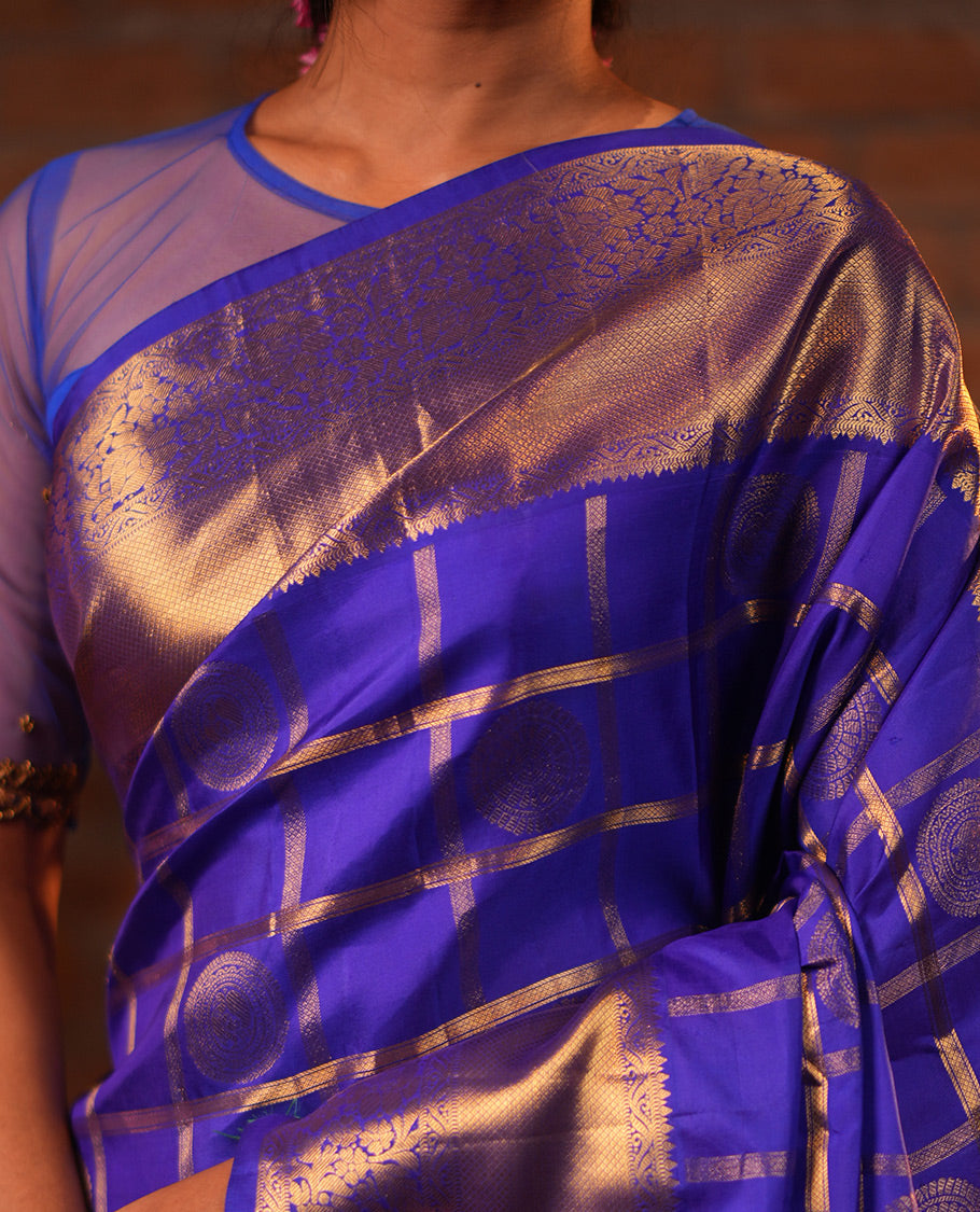 M.s Blue Vasundhara Silk Saree Features Zari Butta Enclosed Checks, a Zari Border of Mayil Kann and Kodi Visiry, Jaal Pallu, and Comes with a Matching Blouse