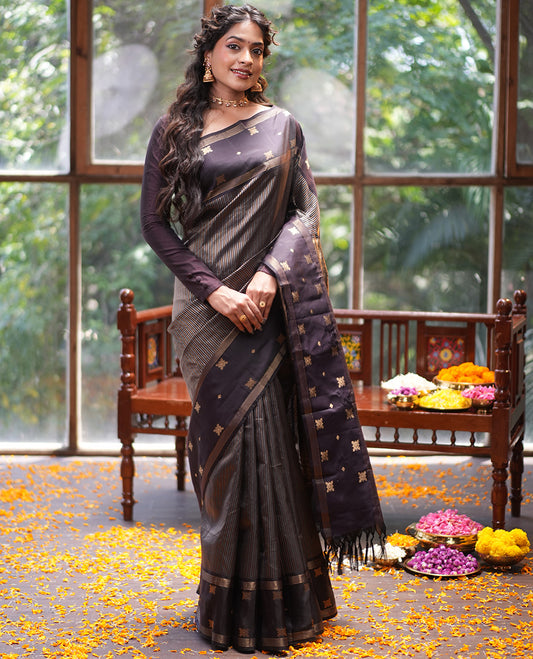 Dark Brown Vasundhara Silk Saree, Elevated with Thick Vaira Oosi-style Stripes On Its Body, Highlighted by Zari Unique Design Border, Grand Jaal Pallu, and Paired with a Matching Blouse