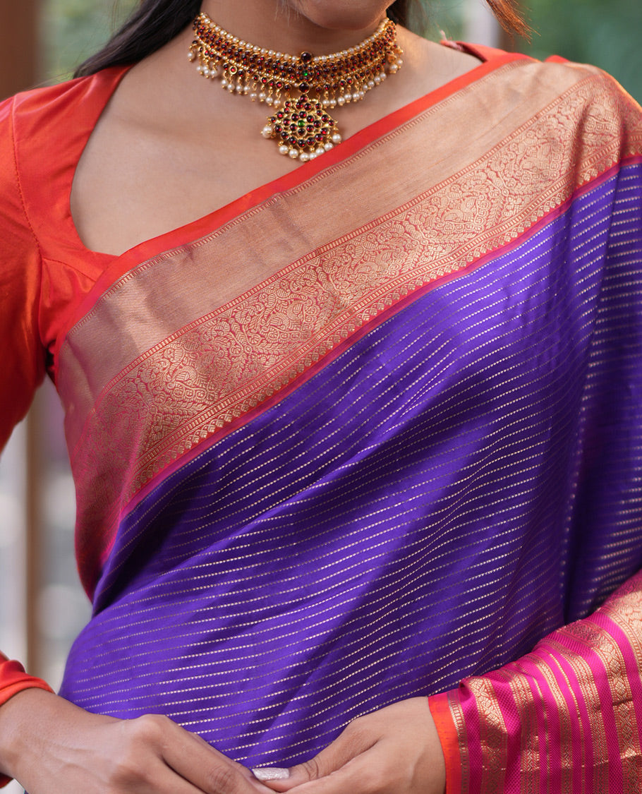 Violet-Pink Vasundhara Silk Saree Features Zari Stripes, a Contrast Border of Thilakam Mokku, Muthu, Mayil, Neli, and Cross Kamalam, Jaal Pallu, and a Contrast Blouse