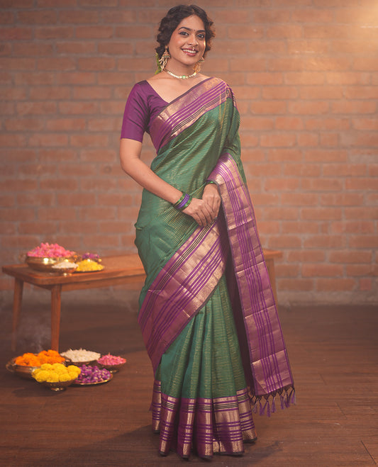 Green and Magenta Vasundhara Silk Saree, Enriched with Veldhari and Muthu Stripes On Its Body, Complemented by Contrast Border of Muthu, Lavangam, Neli, Mayil Kann, And Mayil Designs, Grand Pallu, and Paired with a Contrast Blouse