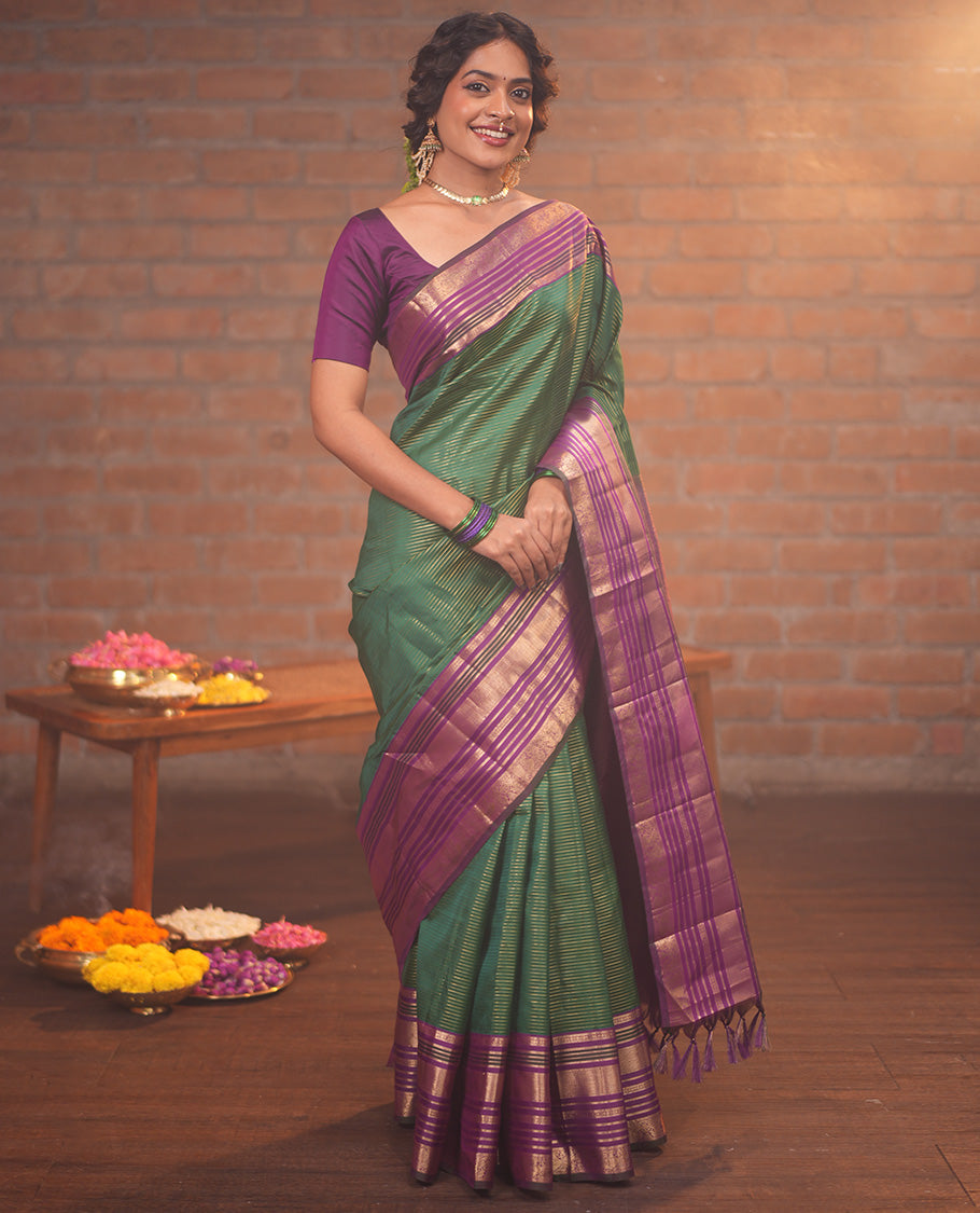 Green and Magenta Vasundhara Silk Saree, Enriched with Veldhari and Muthu Stripes On Its Body, Complemented by Contrast Border of Muthu, Lavangam, Neli, Mayil Kann, And Mayil Designs, Grand Pallu, and Paired with a Contrast Blouse