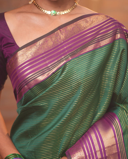 Green-Magenta Vasundhara Silk Saree Features Veldhari and Muthu Stripes, Contrast Border of Muthu,Lavangam,Neli,Mayil Kann, and Mayil, Grand Pallu, and Contrast Blouse