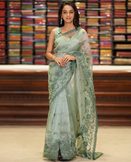 Pista green embroidered tissue organza saree with floral embroidery, scallop border & embroidery pallu along with embroidered blouse