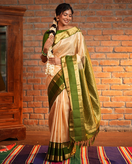 Sandal Vasundhara Silk Saree, Finely Crafted with Zari Buttas and Checked Design, Complemented by a Contrast One-Sided Rettai Pettu Border of Rekku, Laddu Kamalam, Mayil Kann and Kodi Visiry Designs, Grand Jaal Pallu, and Paired with a Contrast Blouse