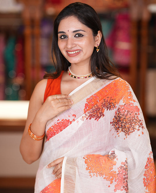 White Linen Cotton Saree with Floral Print, a Gold Zari Border, a Matching Blouse