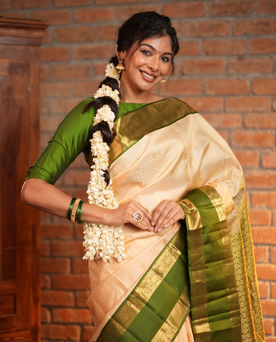 Sandal Vasundhara Silk Saree, Finely Crafted with Zari Buttas and Checked Design, Complemented by a Contrast One-Sided Rettai Pettu Border of Rekku, Laddu Kamalam, Mayil Kann and Kodi Visiry Designs, Grand Jaal Pallu, and Paired with a Contrast Blouse