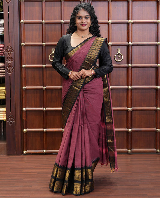 Reddish Brown Plain Chettinad Cotton Saree, Complemented by a Contrast Traditional Rettai Pettu Temple Border of Peacock-Elephant Designs, Subtly Striped Pallu, and Paired with a Matching Blouse