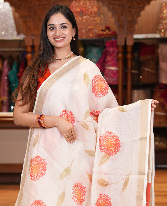 Cream Linen Cotton Saree with Unique Floral Print, a Gold Zari Border, a Contrast Blouse