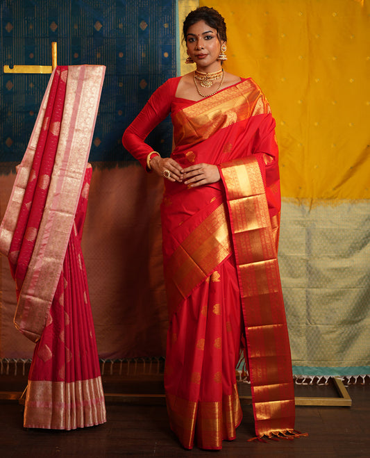 Red Budget Silk Saree, Gleamed Up with Zari Buttas on Its Body, Highlighted by a Zari Border of Traditional Designs, Grand Jaal Design Border, and Paired with a Matching Blouse