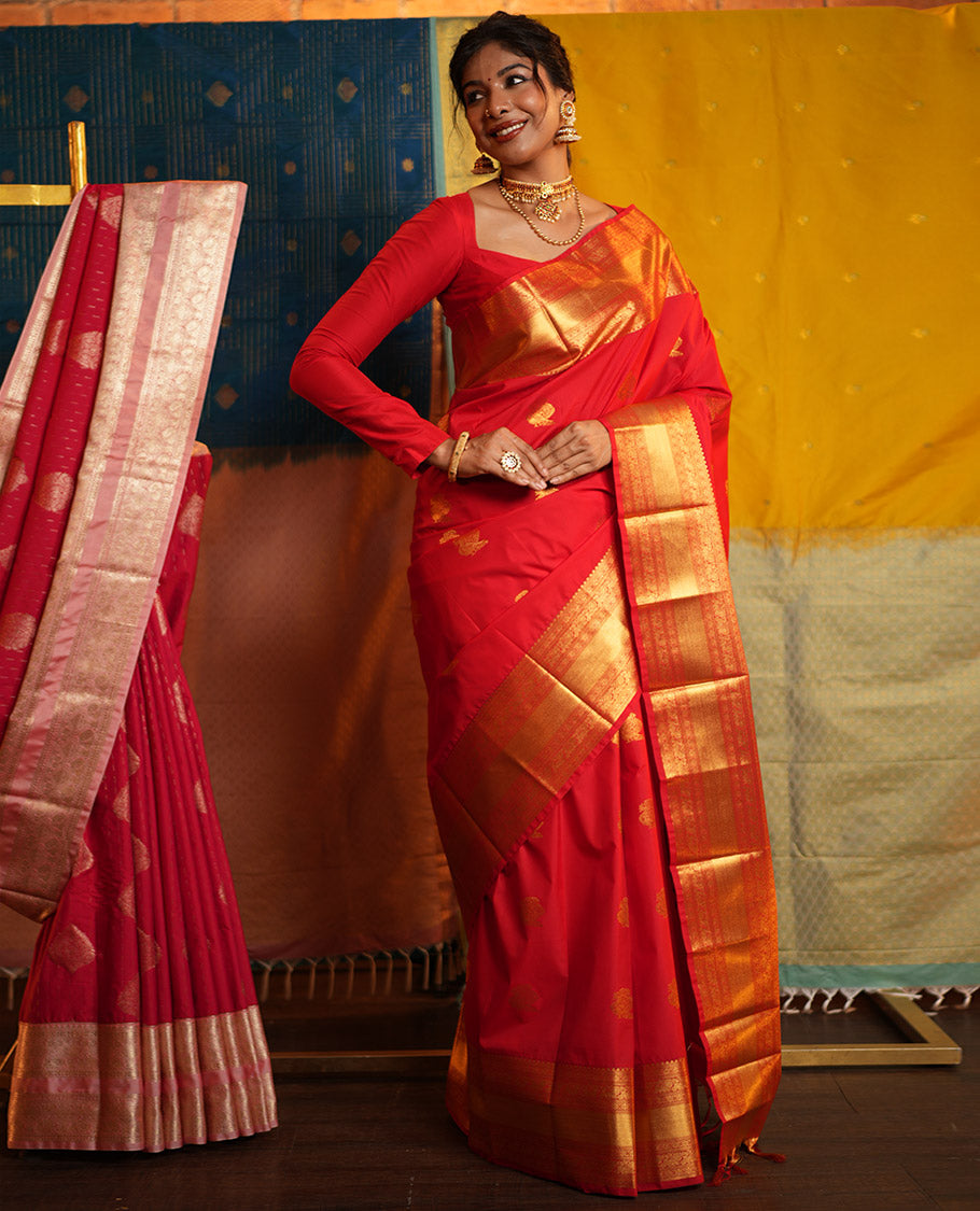 Red Budget Silk Saree, Gleamed Up with Zari Buttas on Its Body, Highlighted by a Zari Border of Traditional Designs, Grand Jaal Design Border, and Paired with a Matching Blouse