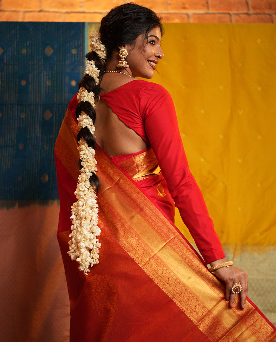 Red Budget Silk Saree, Gleamed Up with Zari Buttas on Its Body, Highlighted by a Zari Border of Traditional Designs, Grand Jaal Design Border, and Paired with a Matching Blouse