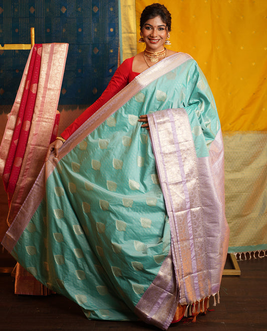 Blue Budget Silk Saree, Steeped in the Richness of Zari Buttas All Over Its Body, Complemented by Contrast Varisai Pettu Traditional Zari Design Border, an Intricately Designed Pallu, and Paired with a Contrast Blouse
