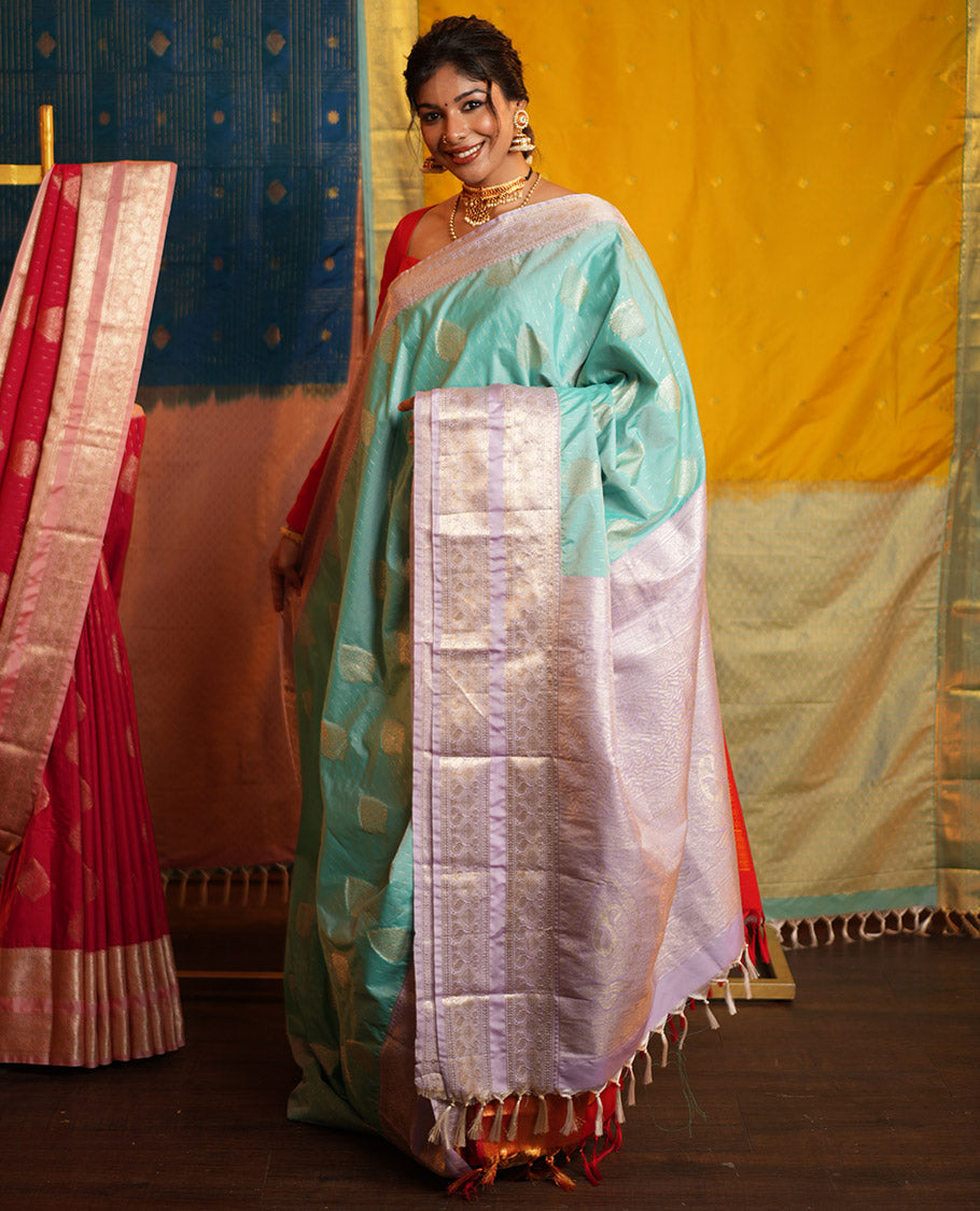 Blue Budget Silk Saree, Steeped in the Richness of Zari Buttas All Over Its Body, Complemented by Contrast Varisai Pettu Traditional Zari Design Border, an Intricately Designed Pallu, and Paired with a Contrast Blouse