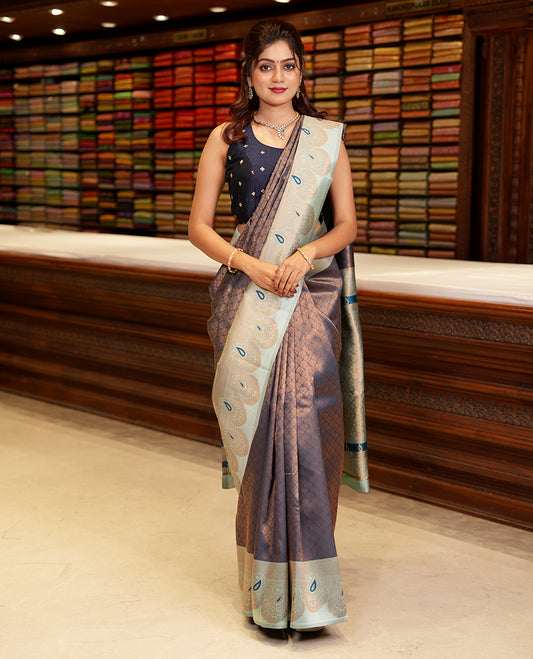 Peacock color copper zari design litchi soft silk saree with contrast mango meena butta border & rich pallu along with brocade blouse
