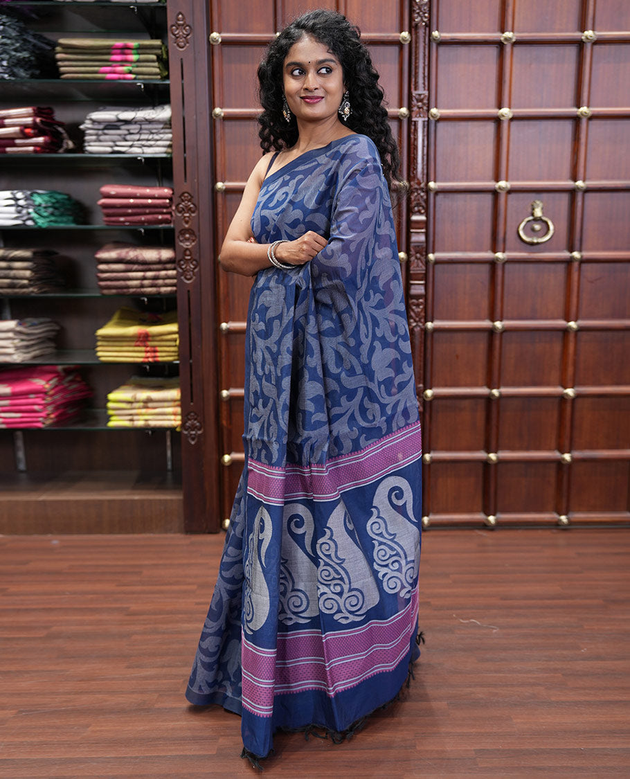 Borderless Blue Coimbatore Cotton Saree, Elevated with Floral Vine Print on Its Body, Self-Pallu Features Paisleys and Geometric Designs, and Paired with a Matching Blouse