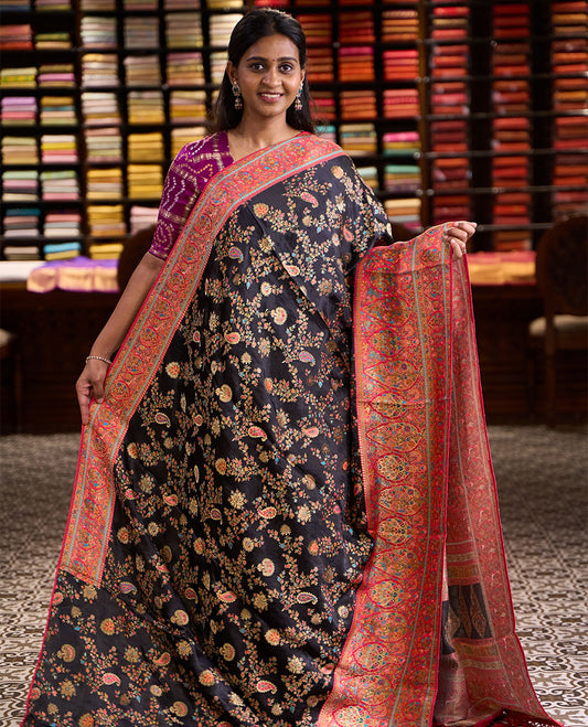 Black meenakari-style floral & paisley vine pattern dola satin silk saree, contrast border & pallu steeped with meenakari-style flora-fauna motifs