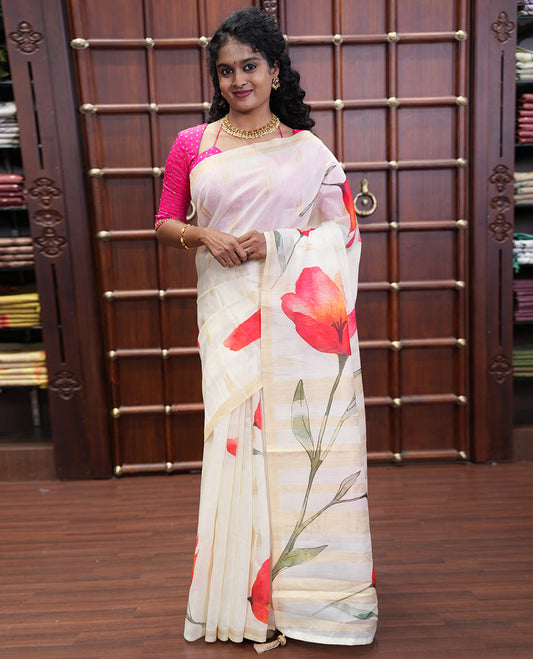 Cream Banaras Tissue Saree, Adorned with Floral Motifs Print and Zari Buttas on Its Body, Subtly Bordered, Pallu Pictures Floral Prints, and Paired with a Matching Printed Blouse