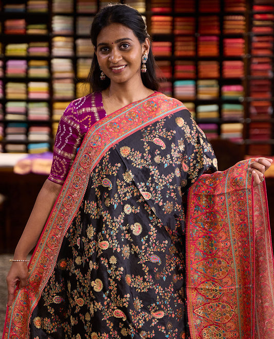 Black meenakari-style floral & paisley vine pattern dola satin silk saree, contrast border & pallu steeped with meenakari-style flora-fauna motifs