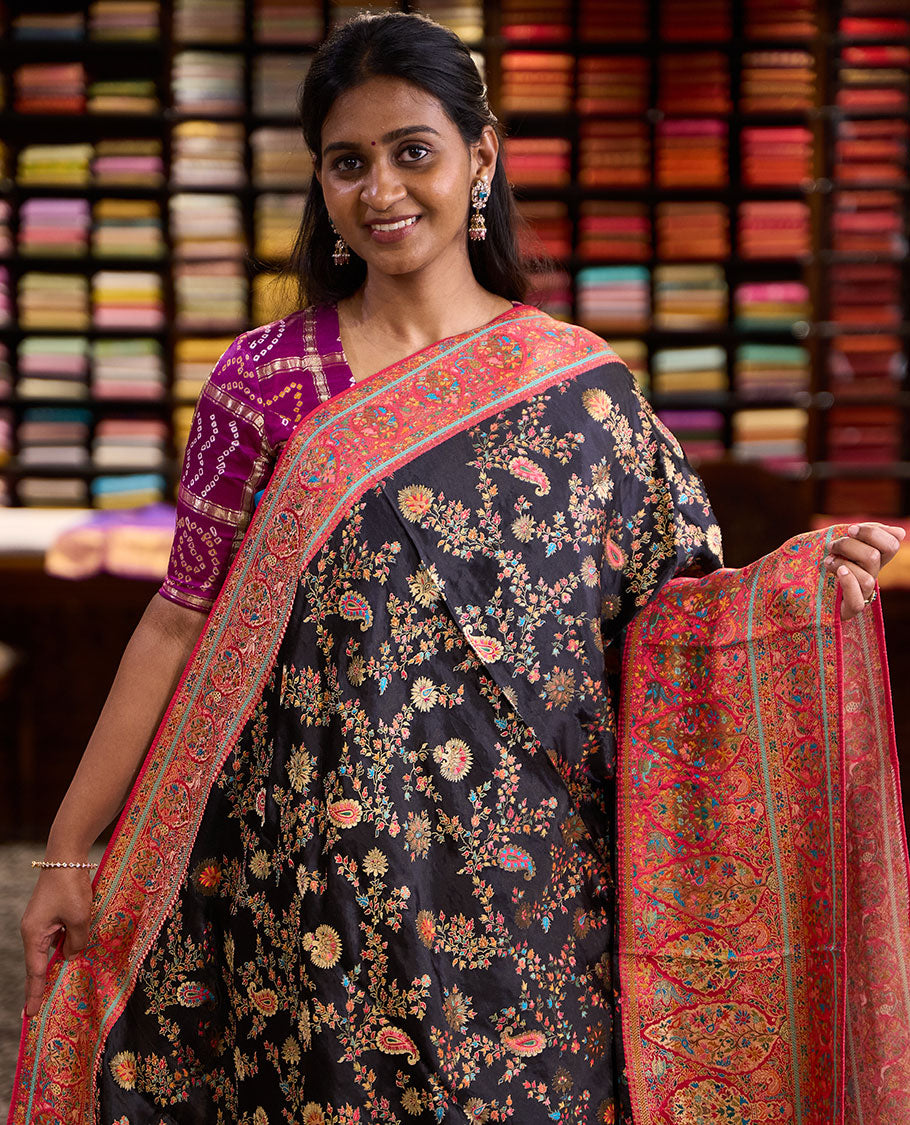 Black meenakari-style floral & paisley vine pattern dola satin silk saree, contrast border & pallu steeped with meenakari-style flora-fauna motifs