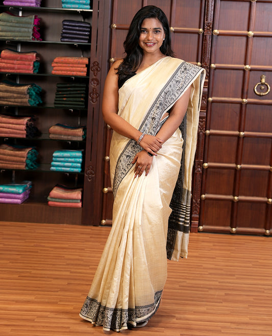 Cream art tussar silk saree with thread border & cheer pallu along with running blouse