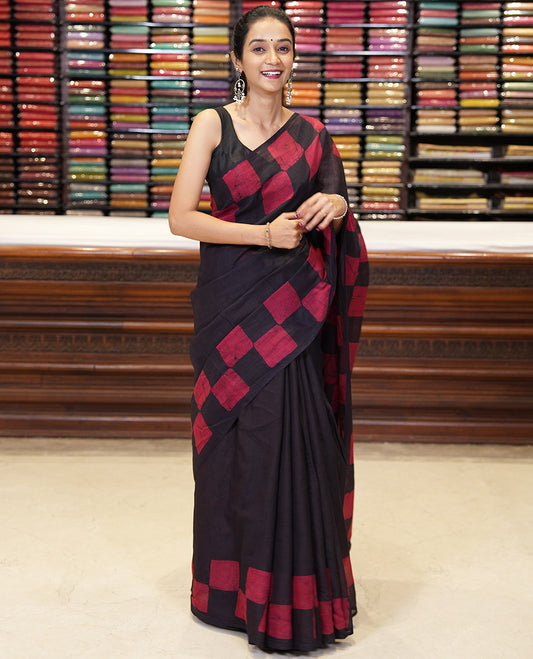 Black kota cotton saree with box type pathik printed border & printed pallu along with printed blouse
