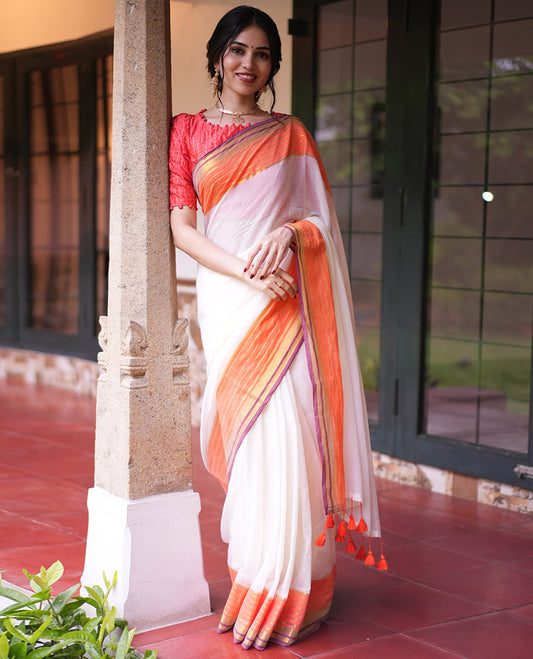 Cream Plain Khadi Mul Cotton Saree, Complemented by a Contrast Orange Border of Zari Stripes, a Self-Pallu, and Has No Blouse