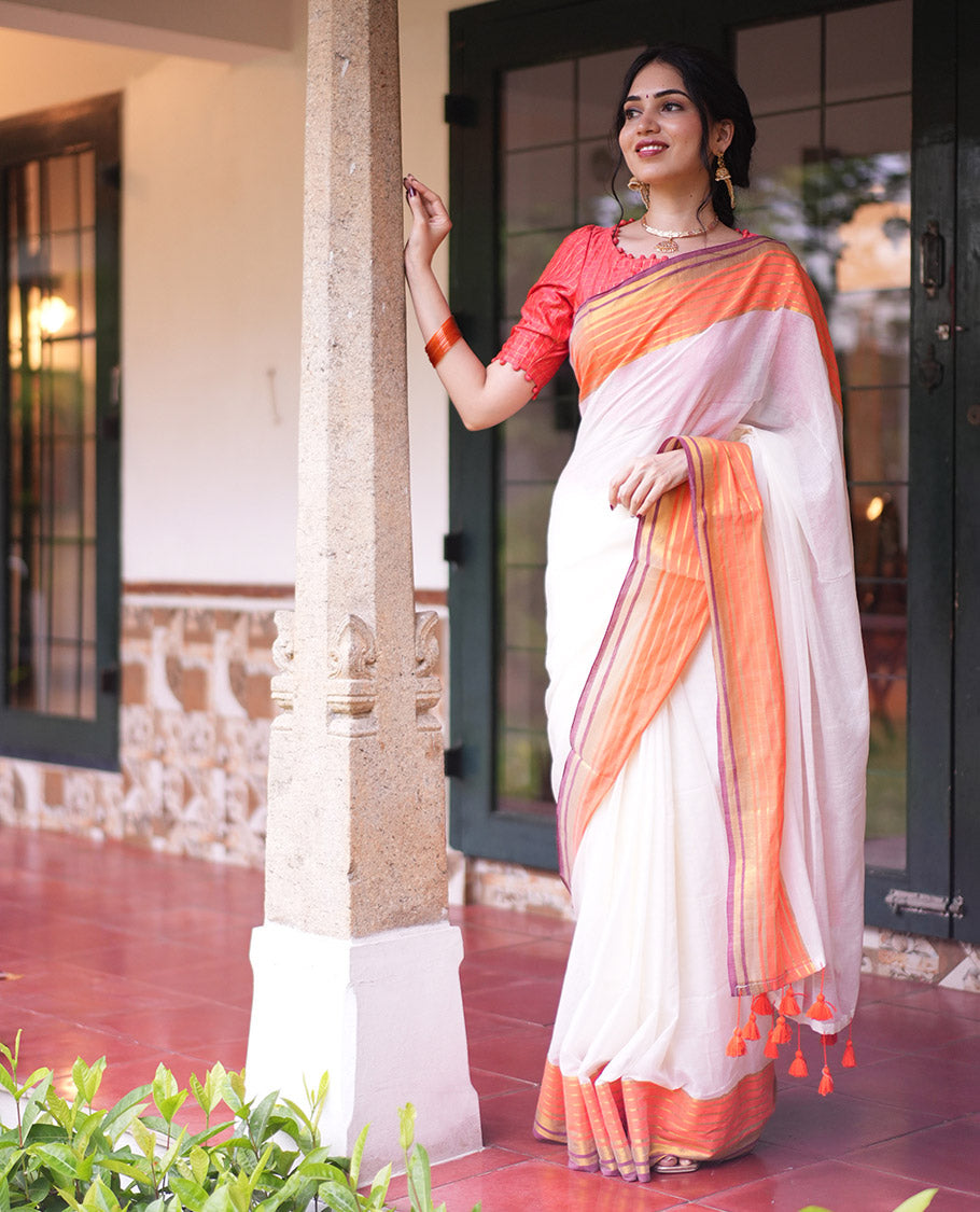 Cream Plain Khadi Mul Cotton Saree, Complemented by a Contrast Orange Border of Zari Stripes, a Self-Pallu, and Has No Blouse