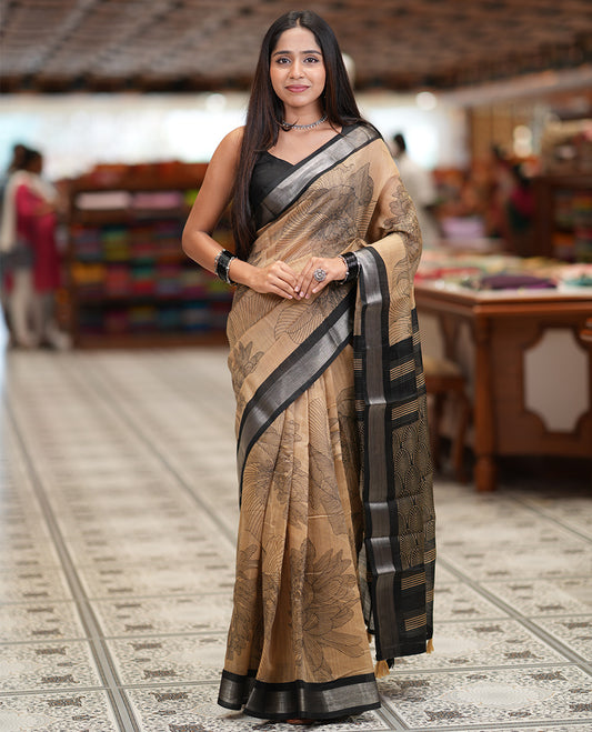 Chikku Jute Linen Saree, Decked Up with Tropical Floral Print, a Contrast Zari Border, Geometric Printed Pallu, and a Contrast Blouse