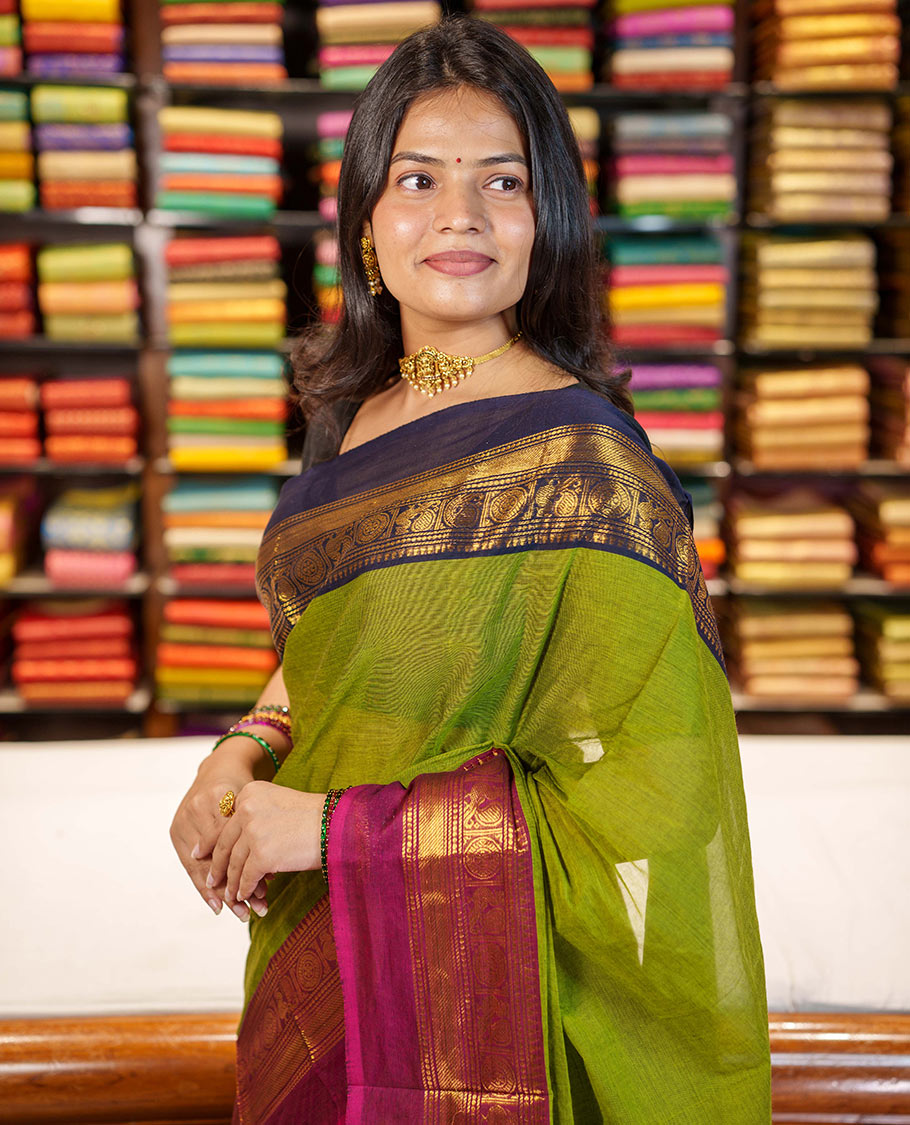 Green Plain Chettinad Cotton Saree, Complemented By Contrast Kal Eragina Traditional Zari Designs Woven Border, Subtly Striped Pallu, and Paired with a Matching Blouse
