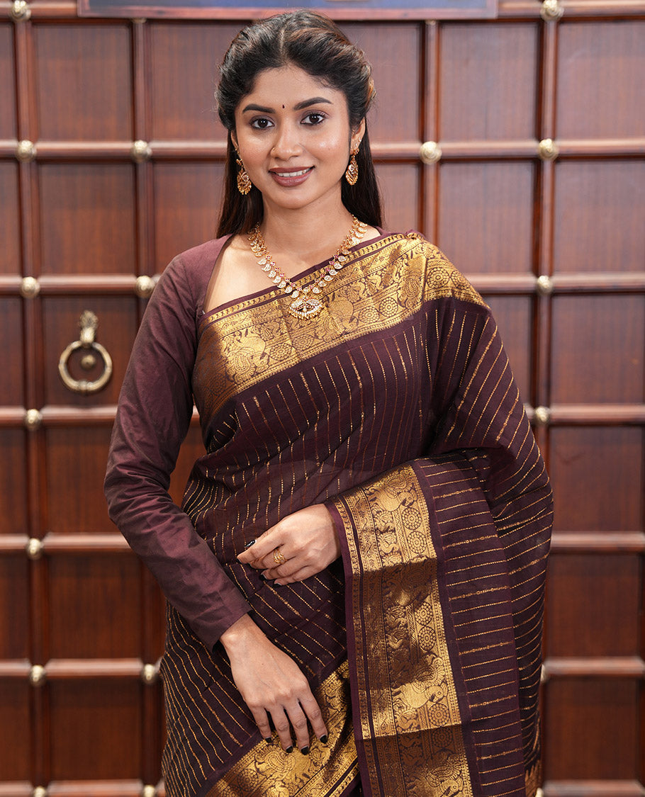 Brown Chettinad Cotton Saree, Spotlighted with Zari Stripes, Traditional Peacock-Chakram Border, Traditional Pallu, and a Matching Blouse