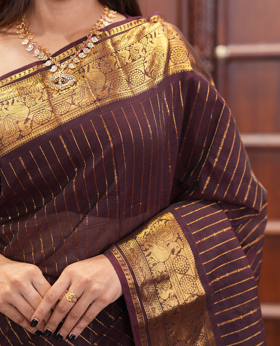 Brown Chettinad Cotton Saree, Spotlighted with Zari Stripes, Traditional Peacock-Chakram Border, Traditional Pallu, and a Matching Blouse