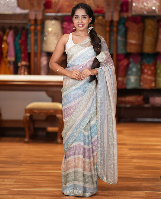 Blue Fendi Chiffon Saree, Dazzled with Multi-Color Floral Stripes and Glitterwork, a Stonework Border, a Matching Blouse