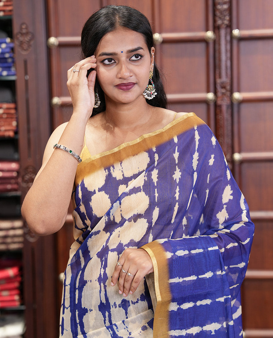 Navy Blue Mercerised Cotton Saree, Embellished with Shibori Printed on Its Body, Complemented by a Contrast Border, Pallu Steeped with Colorful Floral Print, and Paired with a Contrast Printed Blouse