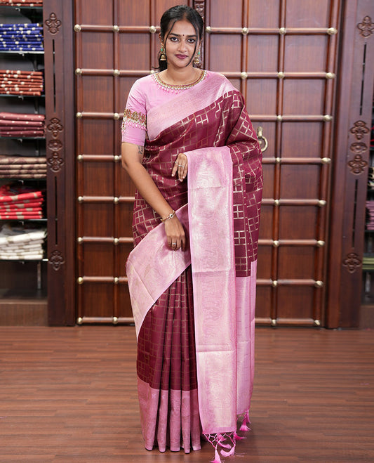 Maroon Elite Soft Silk Saree, Enriched with Checked Design on Its Body, Complemented by a Contrast Border of Jungle-Themed Flora-Fauna Motifs, a Pallu of Checked Design, and Paired with a Contrast Blouse