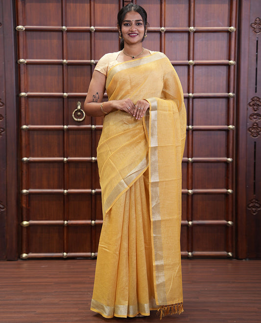 Yellow Tissue Saree, Gleamed Up with Zari Striped on Its Body, Highlighted by a Zari Border, Pallu Steeped with Zari Stripes, and Paired with a Matching Blouse