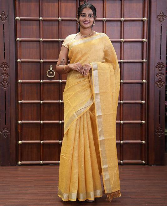Yellow Tissue Saree, Gleamed Up with Zari Striped on Its Body, Highlighted by a Zari Border, Pallu Steeped with Zari Stripes, and Paired with a Matching Blouse