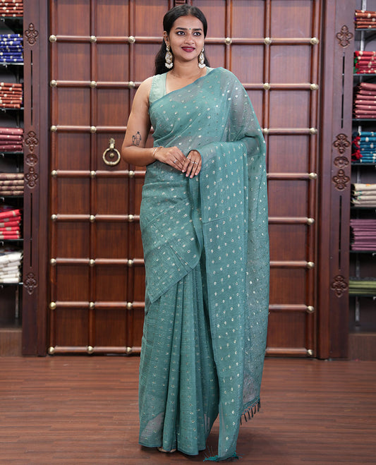 Borderless Blue Shimmer Saree, Subtly Sparkled with Zari Buttas All Over Its Body, Pallu Mirrors the Same Buttas, and Comes Without a Blouse