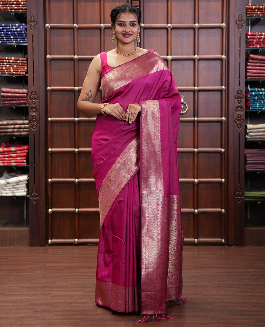 Pink Plain Semi-Soft Silk Saree, Elevated with Traditional Zari Designs Woven Border, Grandly Woven Pallu Steeped with Chakram Designs, and Paired with a Matching Blouse