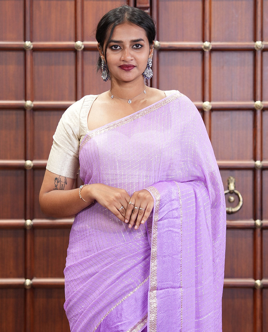Scintillating Lavender Viscose Georgette Saree Gleamed Up with Checked Design on Its Body, Highlighted by a Double-Pet Border, Zari Checked Design Pallu, and Paired with a Matching Blouse