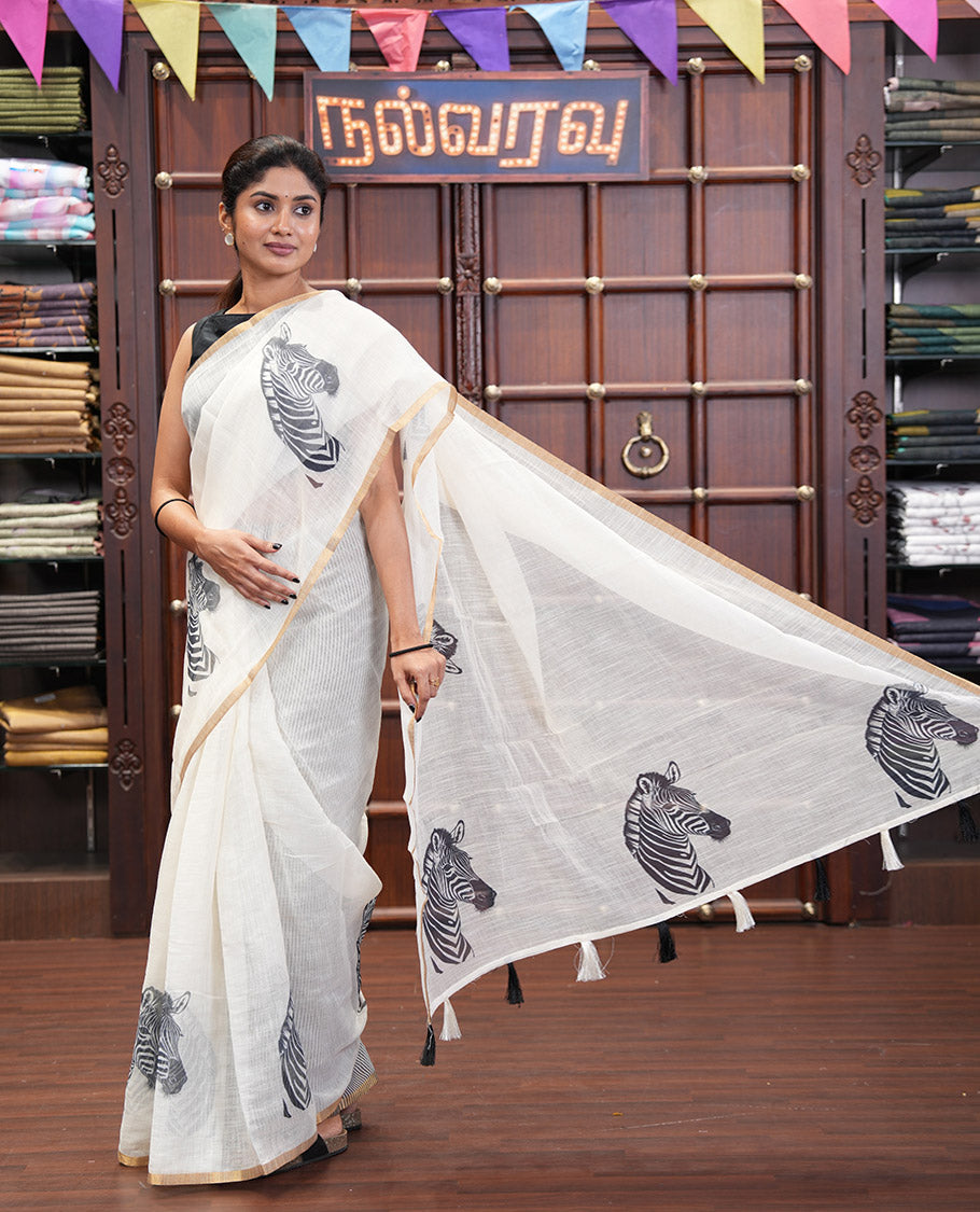 Off-white Linen Cotton Saree, Accentuated with Zebra Motifs Print, A Subtle Piping Border, Zebra Printed Pallu, and Comes with a Contrast Blouse