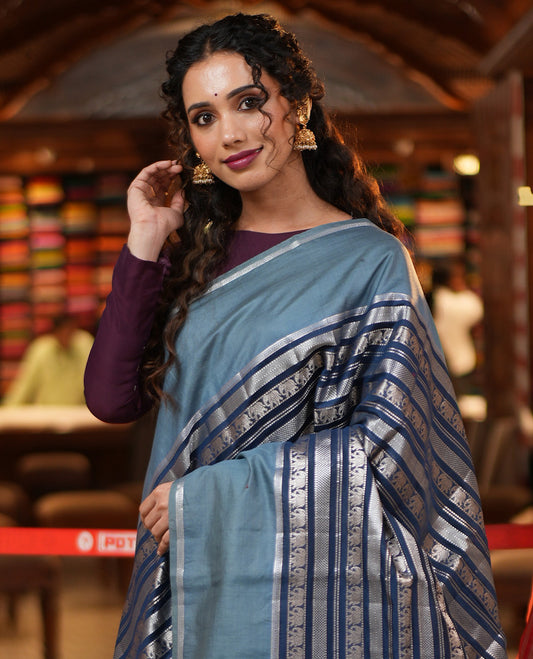 Navy Blue Organza Saree, Richly Zari Detailed with Geometric and Elephant Motifs All Over Its Body, Complemented by Captivating Contrast Zari Border, Zari Decked Up Pallu, and Paired with a Contrast Blouse