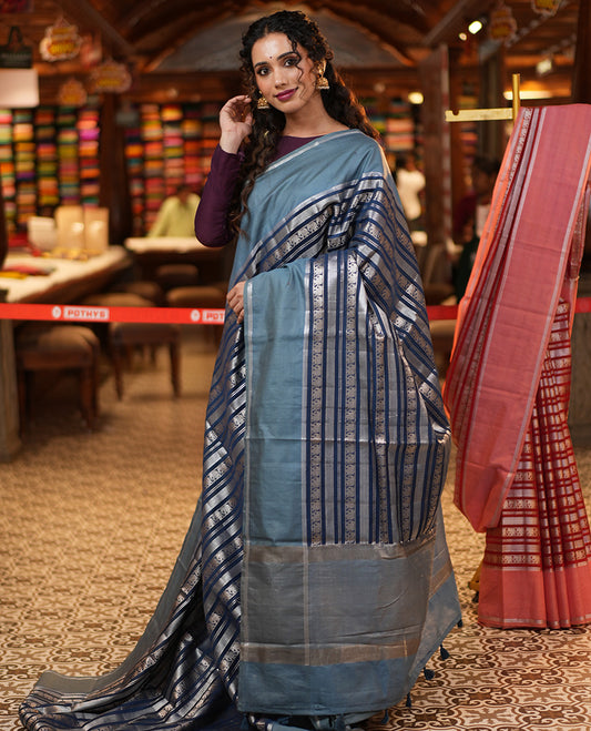 Navy Blue Organza Saree, Richly Zari Detailed with Geometric and Elephant Motifs All Over Its Body, Complemented by Captivating Contrast Zari Border, Zari Decked Up Pallu, and Paired with a Contrast Blouse
