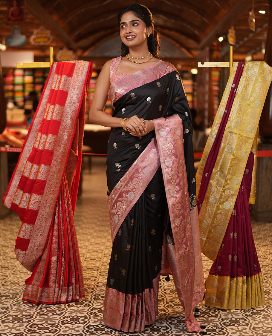 Black Mushuru Silk Saree, Adorned with Zari Buttas All Over Its Body, Complemented by Captivating Contrast Border of Floral Jaal Designs, Grandly Decked Up Pallu and Paired with a Contrast Blouse