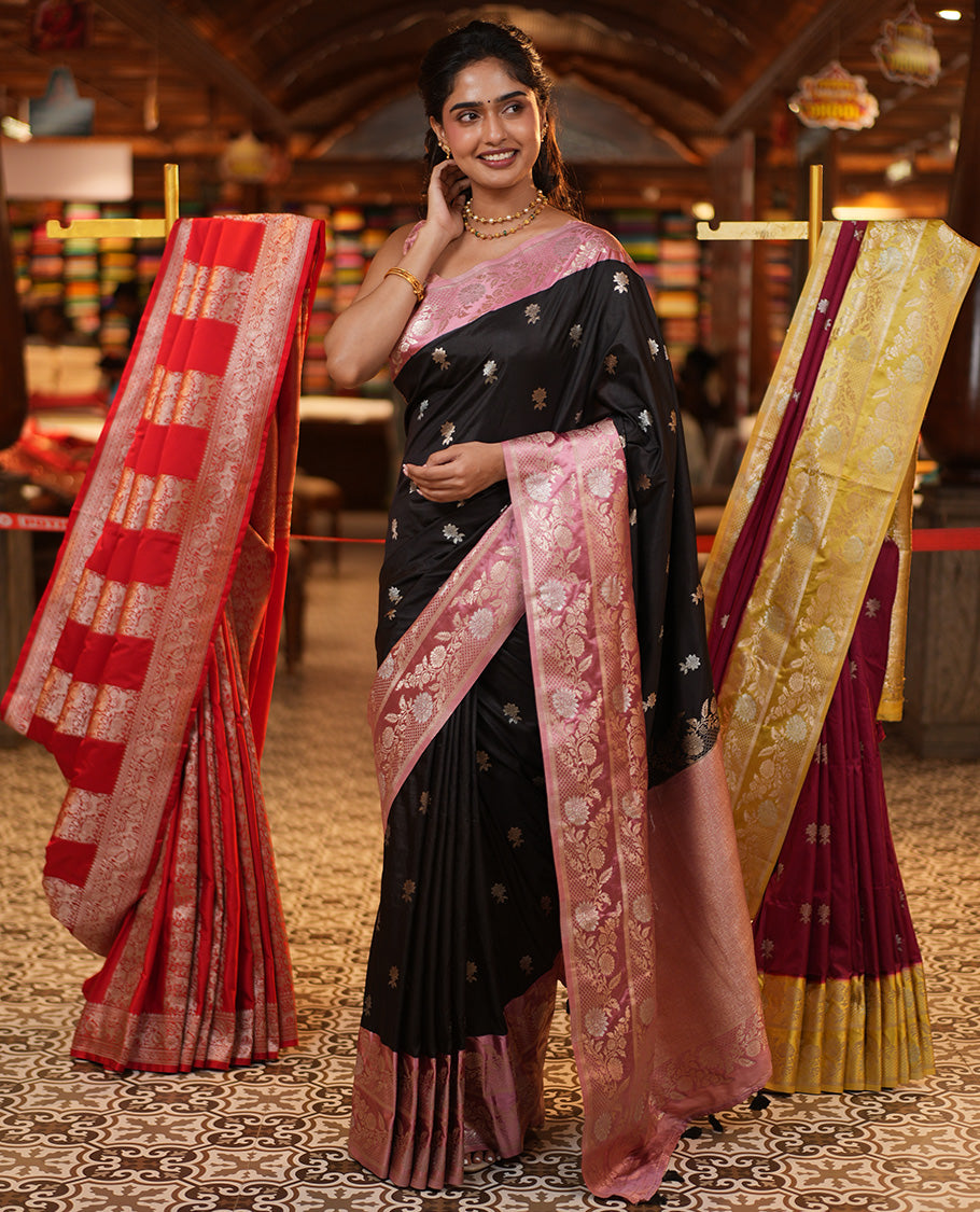 Black Mushuru Silk Saree, Adorned with Zari Buttas All Over Its Body, Complemented by Captivating Contrast Border of Floral Jaal Designs, Grandly Decked Up Pallu and Paired with a Contrast Blouse