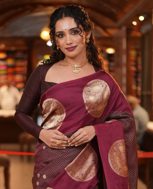 Coffee Maroon H O-Silk Saree, Richly Detailed with Zari Buttas and Zari Checks On Its Body, Accentuated with Contrast Big Chakram Motifs Woven Border, Grand Jaal Design Woven Pallu, and Paired with a Checked Blouse