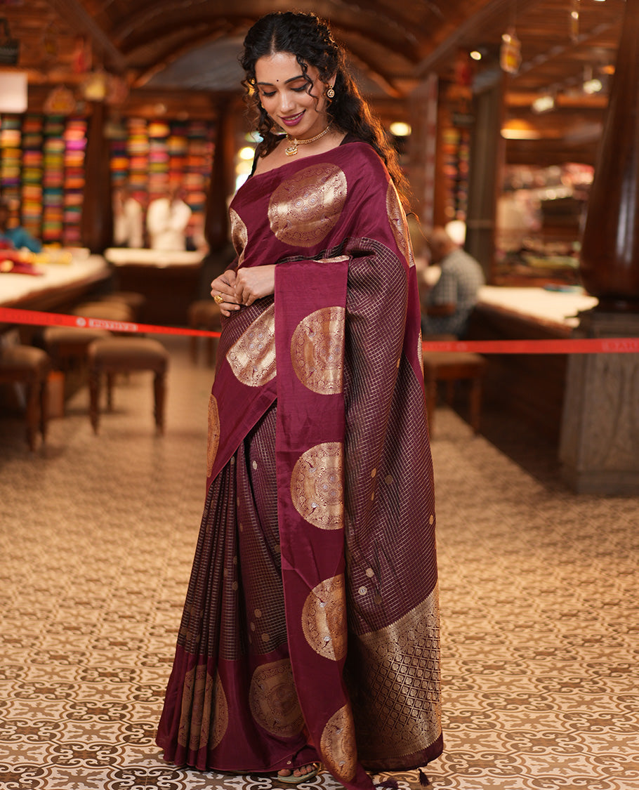 Coffee Maroon H O-Silk Saree, Richly Detailed with Zari Buttas and Zari Checks On Its Body, Accentuated with Contrast Big Chakram Motifs Woven Border, Grand Jaal Design Woven Pallu, and Paired with a Checked Blouse