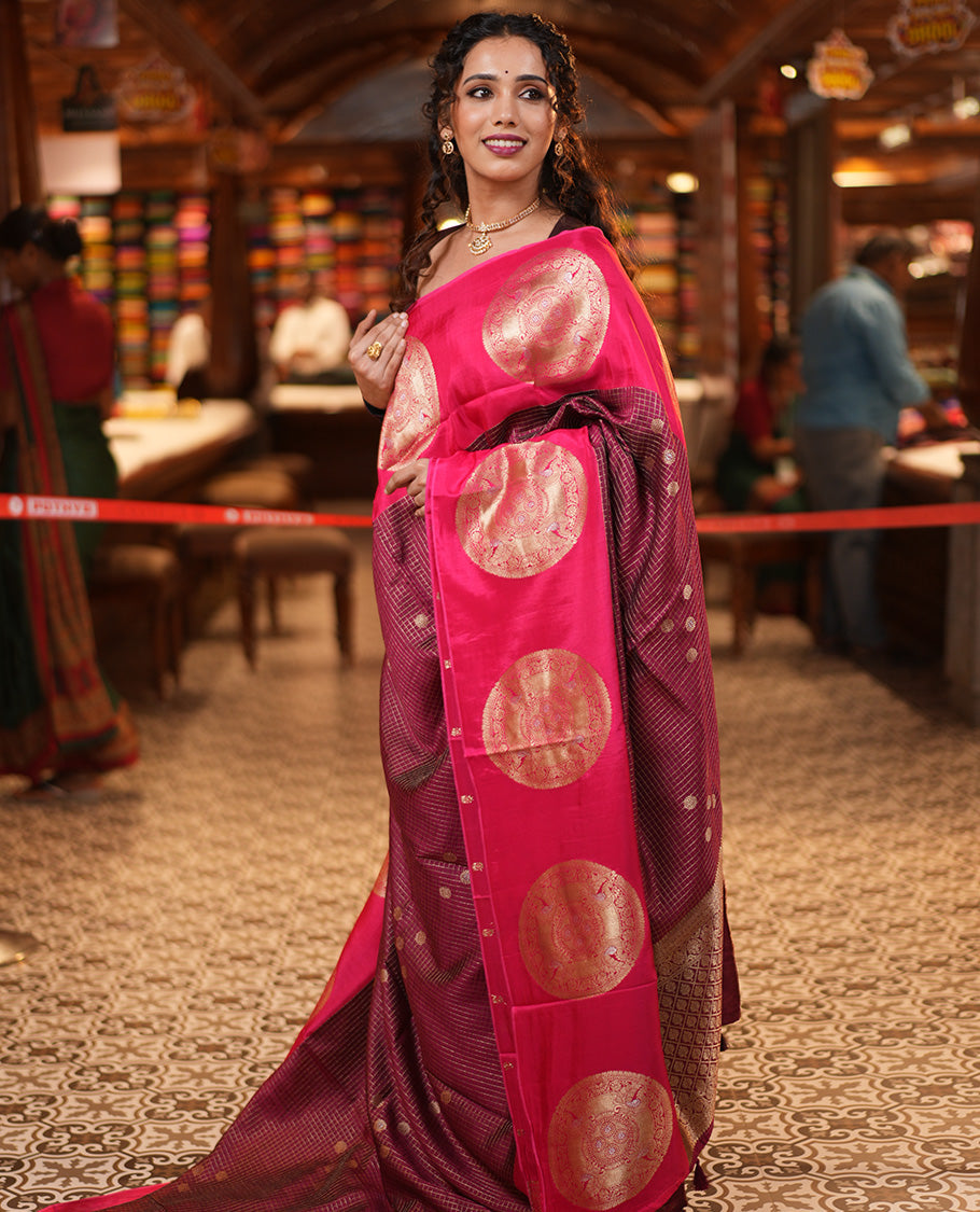 Maroon H O-Silk Saree, Elegantly Detailed with Zari Buttas and Zari Checks On Its Body, Accentuated with Contrast Big Chakram Motifs Woven Border, Grand Jaal Design Woven Pallu, and Paired with a Checked Blouse