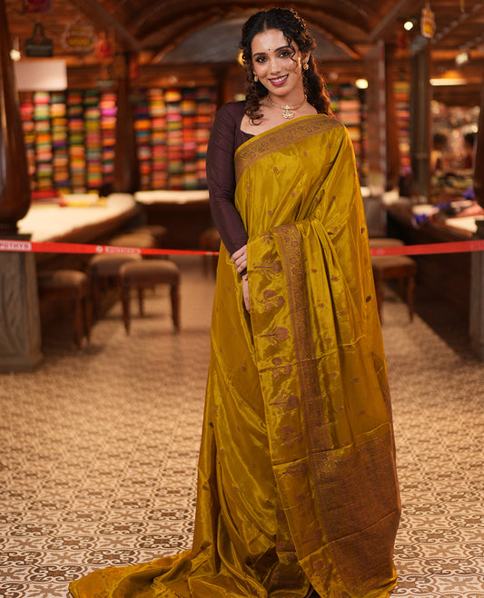 Green HO-Silk Saree, Adorned with Zari Buttas All Over Its Body, Highlighted by a Self-Border of Floral Designs, Pallu Features Floral Designs, and Paired with a Buttas-woven Blouse