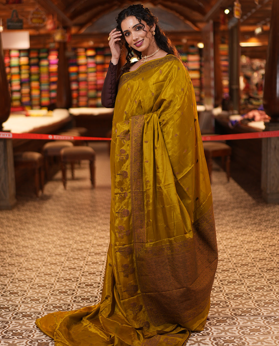 Green HO-Silk Saree, Adorned with Zari Buttas All Over Its Body, Highlighted by a Self-Border of Floral Designs, Pallu Features Floral Designs, and Paired with a Buttas-woven Blouse