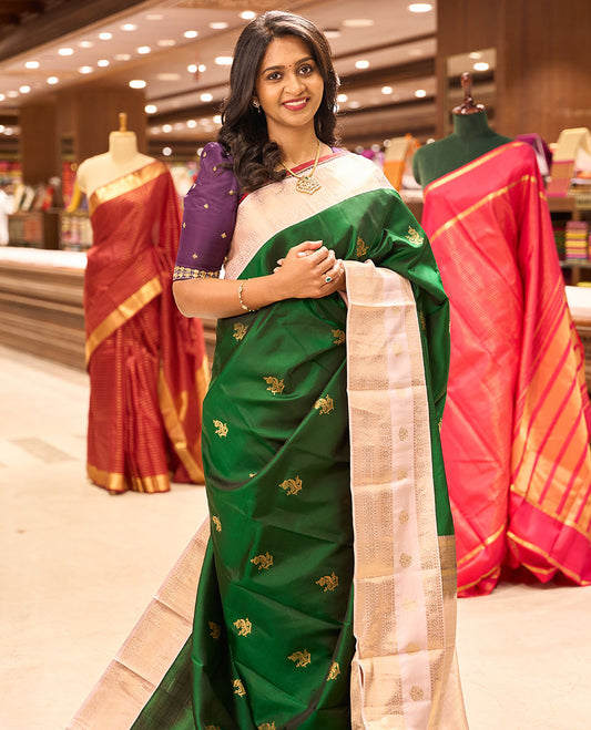 green floral buttas silk saree with contrast intricate zari design border & jaal pallu